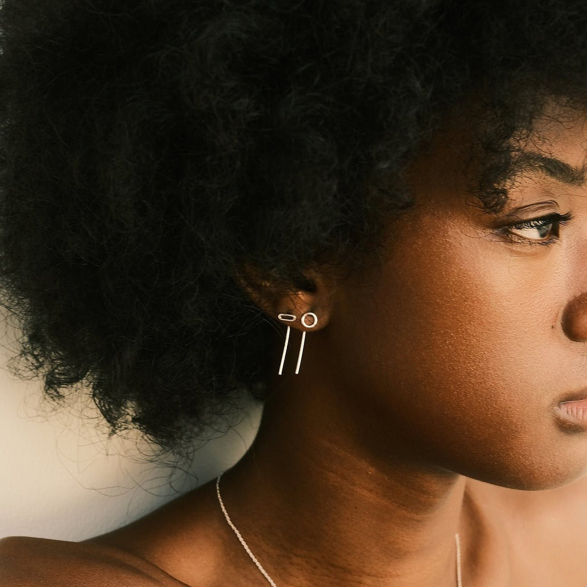 Evidence Stone wears the Silver Carla and Emma Earrings by Aurore Havenne